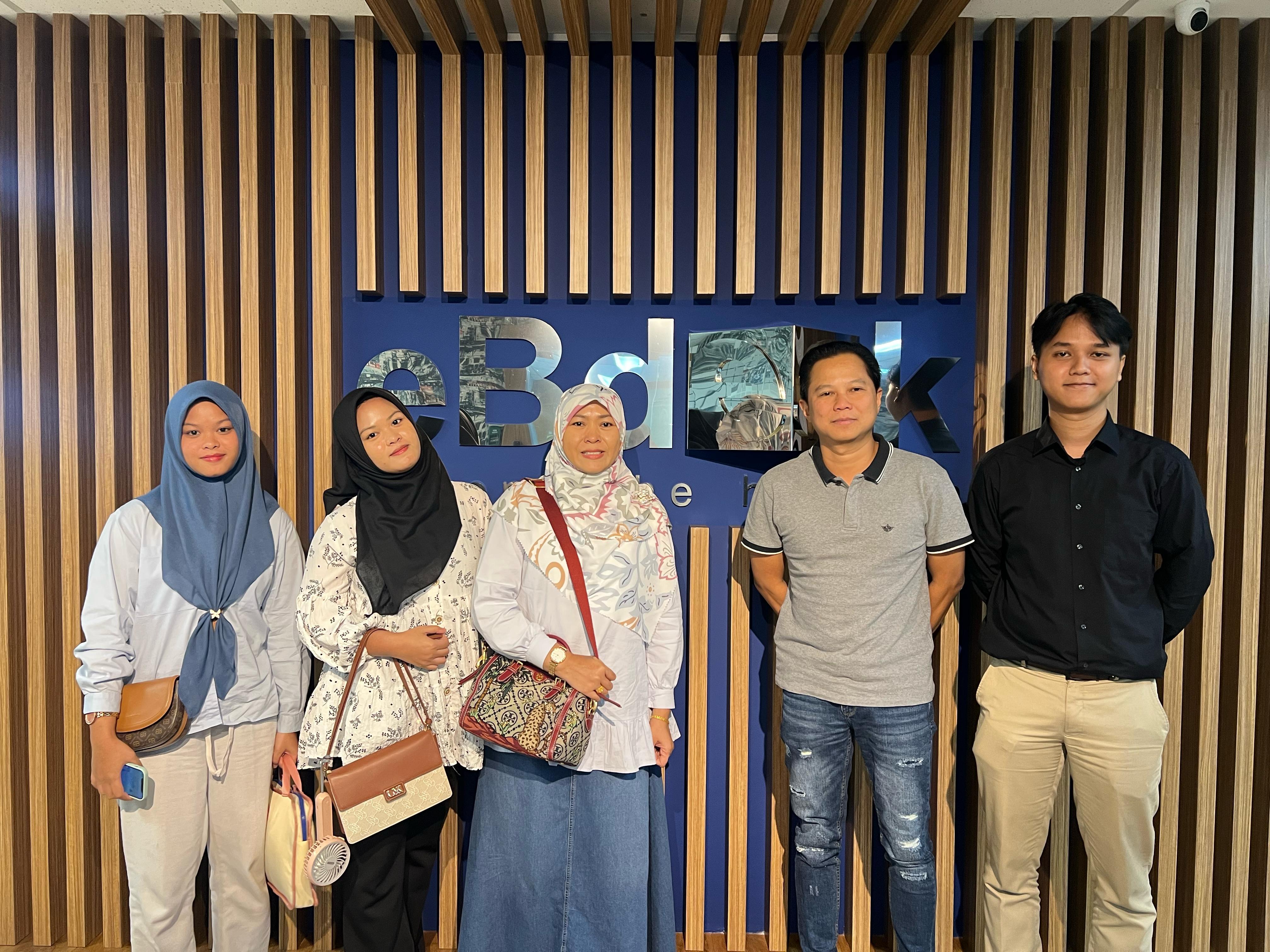 Traditional street market in Asia with colorful fabrics and lanterns